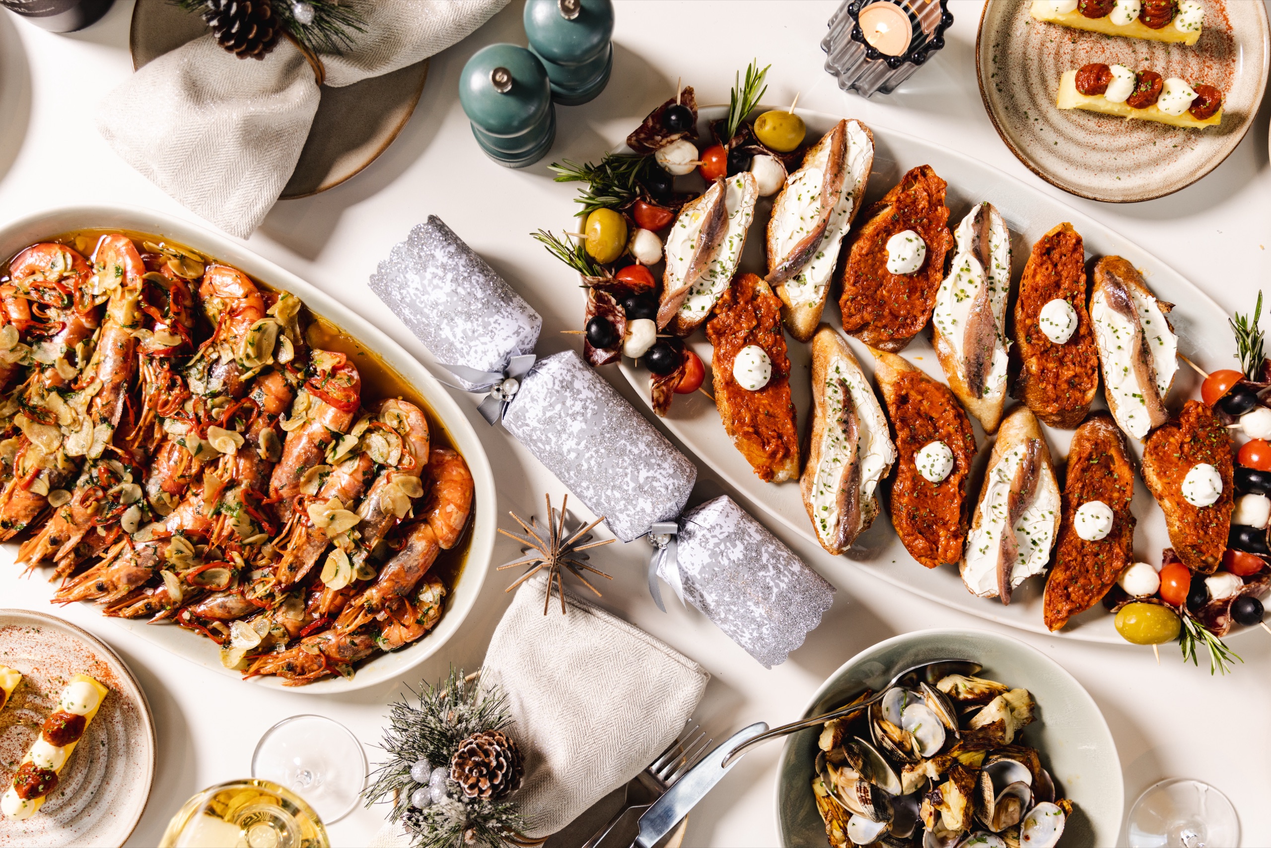 A celebratory spread of Spanish tapas and pinchos laid out for a large group booking